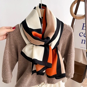 Fashionable long scarf with geometric color block patterns for autumn and winter warmth