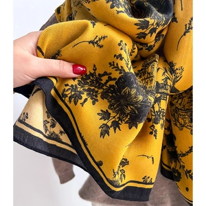 Mustard yellow wool-like scarf with black floral and European architecture prints