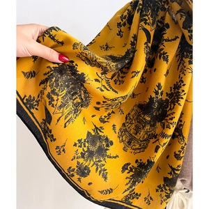 Detailed view of yellow Toile de Jouy print scarf with vintage European patterns