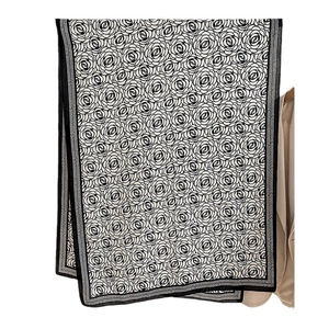 Elegant black and white winter scarf with rose patterns and wide herringbone borders