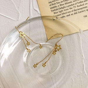 Long tassel star earrings in gold titanium steel with dangling hollow pentagram charms