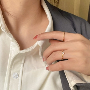 Minimalist 18K gold plated titanium steel ring with sparkling zircon in a stacked style