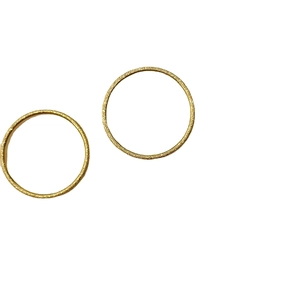 Two-piece set of minimalist gold matte frosted titanium steel rings on white background