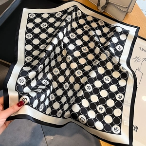 Polka dot silk scarf featuring camellia floral patterns and elegant black borders