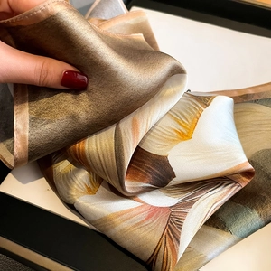 Elegant 100% mulberry silk square scarf with earthy floral patterns and soft satin luster