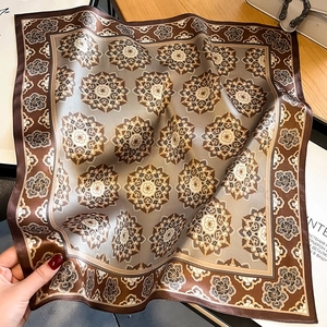 Elegant silk scarf with mandala geometric pattern in champagne gold and taupe tones