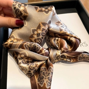 Elegant silk scarf featuring vintage floral print in earthy brown tones for women