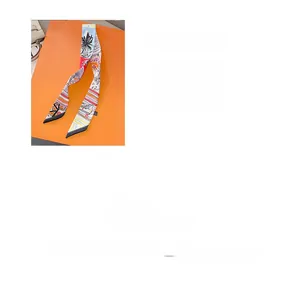 Close-up of multicolor digital print silk scarf twilly with palm and geometric patterns