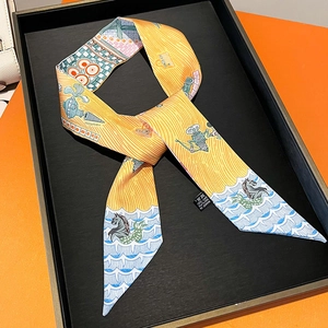 Detailed close-up of a premium silk twilly ribbon with luxury nautical prints