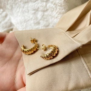 Elegant gold twisted croissant earrings with polished spiral texture for women