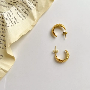 Elegant gold croissant dome hoop earrings with twisted French style design for women
