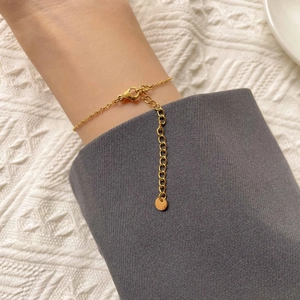 Elegant gold double circle link bracelet with adjustable lobster clasp on woman wrist