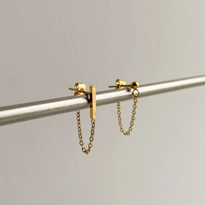 Asymmetric gold chain drop earrings with minimalist bar and bead studs in polished finish