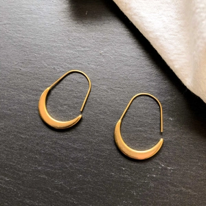 French minimalist gold U-shape crescent hoop earrings with brushed metal finish
