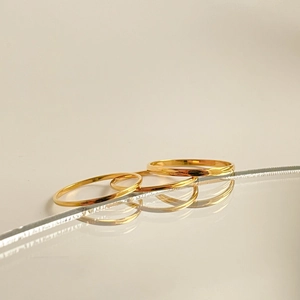 Set of three minimalist polished gold finish stainless steel rings for stacking