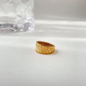 Detailed view of vintage gold-plated wheat texture ring with light and shadow effects