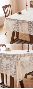 Close-up of cream white lace tablecloth featuring hollow floral embroidery and tassels