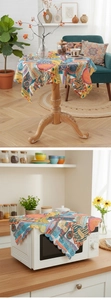 Detail of Bohemian dust cover with vibrant geometric patterns on a round table and microwave