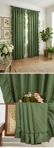 Close-up of olive green curtain with ruffled edges and thick textured shading fabric