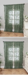 Close-up of vintage green lace curtain with floral embroidery and ruffled edge details