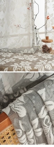 Detail of floral lace jacquard curtain showing intricate mesh texture and hollow pattern
