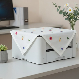 White minimalist dust cover for printers with colorful embroidered floral patterns
