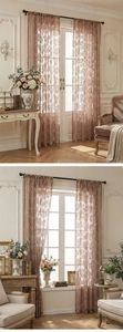 Detailed close-up of pink floral lace curtains with vintage embroidery in a bright room