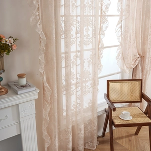 Elegant French vintage lace curtains with floral patterns and ruffle edges in off-white