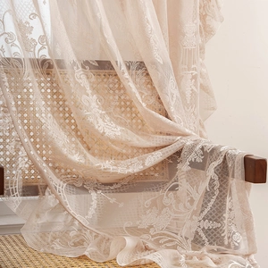French retro beige lace curtain with floral patterns and ruffled edges in soft light