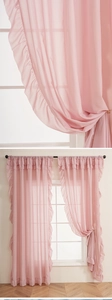 Close-up of pink ruffle curtains showing soft semi-transparent sheer fabric texture