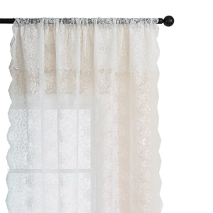 White lace curtain with delicate floral patterns and scalloped edges on a metal rod