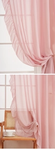 Detail of pink ruffled sheer curtain with soft light filtering and elegant drape