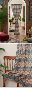Close-up of bohemian ethnic pattern fabric with vintage geometric diamond and floral prints