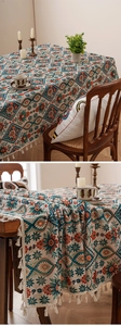 Detailed view of bohemian floral tablecloth featuring white cotton tassels and thick texture