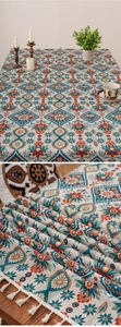 Detail of bohemian floral pattern and handmade white tassels on a cotton linen tablecloth