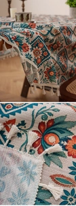 Detail of bohemian floral pattern linen tablecloth with decorative cotton fringes
