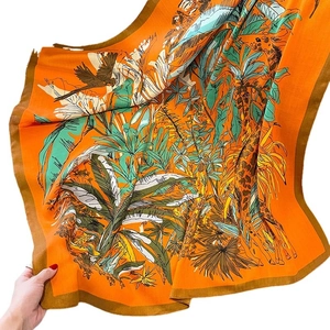 Orange vintage silk scarf with tropical giraffe and palm print for elegant women