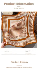 Detail of 90x90cm orange houndstooth scarf with premium wool-feel texture and soft finish