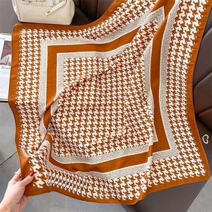 Classic orange and white houndstooth silk scarf on premium leather with fashion accessories