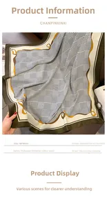 Flat lay of vintage plaid 90x90cm scarf with green trim and soft cashmere-like texture