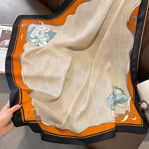 Classic houndstooth silk scarf with orange contrast border and floral print details