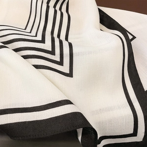 Modern black and white striped scarf with premium wool-feel twill texture and soft drape