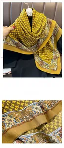 Detail of vintage yellow silk scarf showing classic chain pattern and fine stitched edges