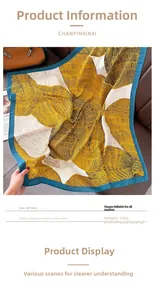 Detailed view of 90cm square scarf with yellow feather print and blue border texture