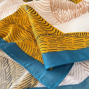 Mustard yellow and navy wool-like oversized square scarf with abstract stripe patterns