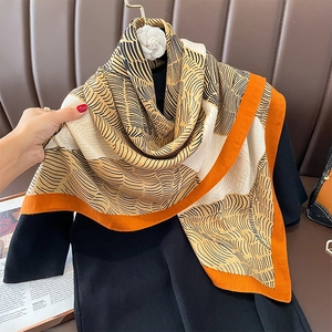 Elegant sheep wool feel scarf with orange borders and abstract stripes on creamy background