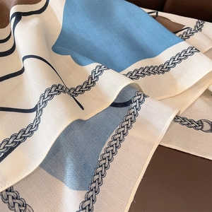 Elegant 90cm square silk scarf with blue and brown chain pattern and twill texture