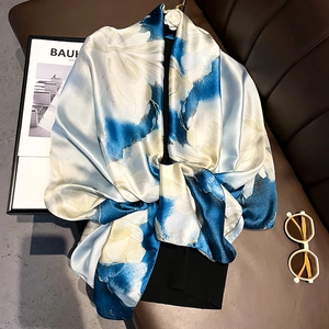 Elegant blue and white floral print silk scarf with a soft glossy finish for women
