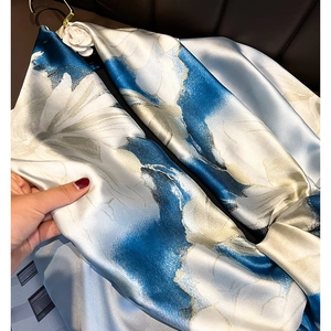Blue and white floral print silk scarf featuring a premium satin finish and soft texture