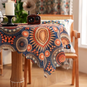 Detail of bohemian mandala print tablecloth with elegant scalloped laser-cut edges